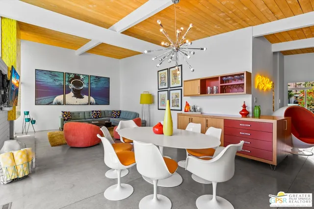 a work room with furniture and wooden floor