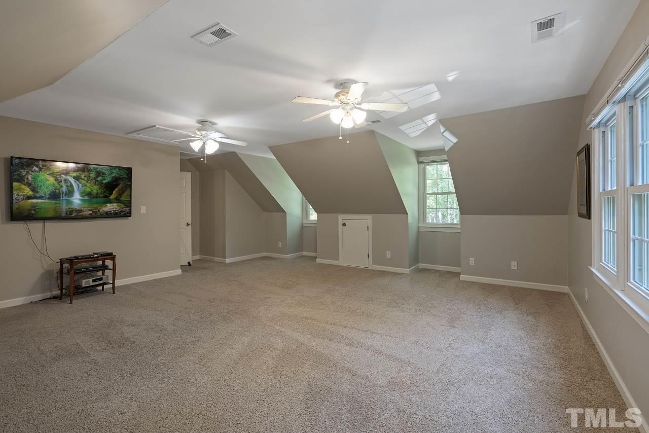 14225 Wyndfield Circle Raleigh, NC 27615 - Photo 19 of 30 Custom blinds for optimal movie viewing at any time of day do convey!