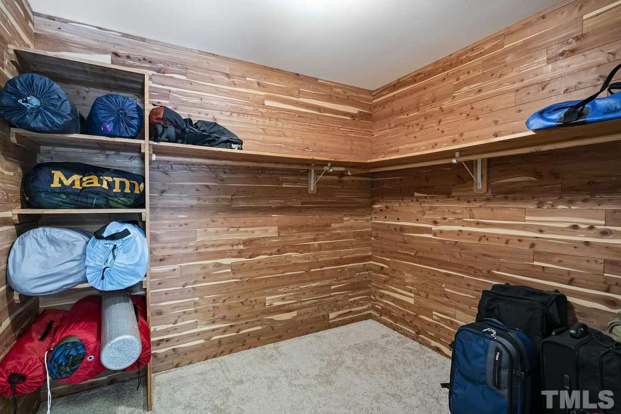 14225 Wyndfield Circle Raleigh, NC 27615 - Photo 25 of 30 Behind this closet is large storage space with spray foam insulation!