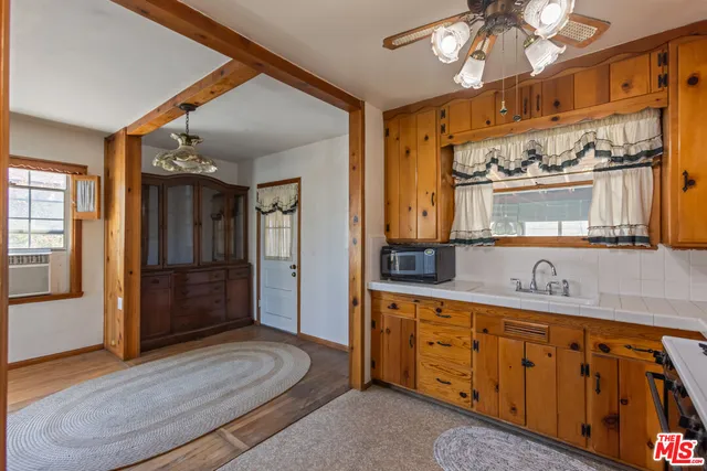 a spacious bathroom with a double vanity sink a mirror and a shower