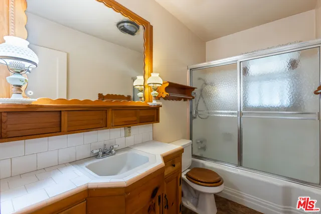 a view of a chairs and table in the patio