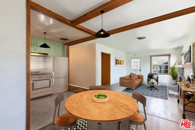 a view of a livingroom with furniture and wooden floor