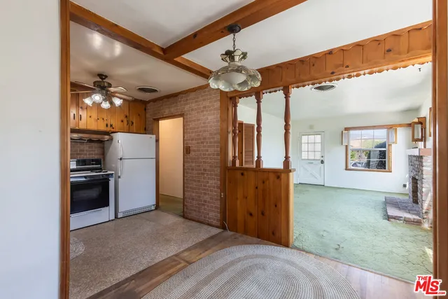 a view of a kitchen with a refrigerator