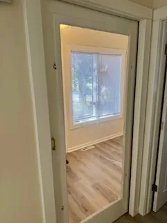 a bathroom with a sink mirror and toilet