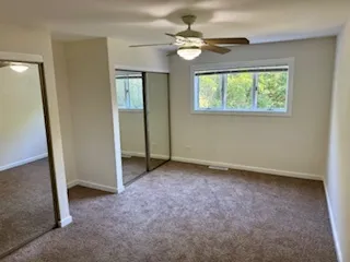an empty room with closet area