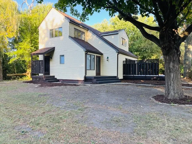 a house with trees in front of it