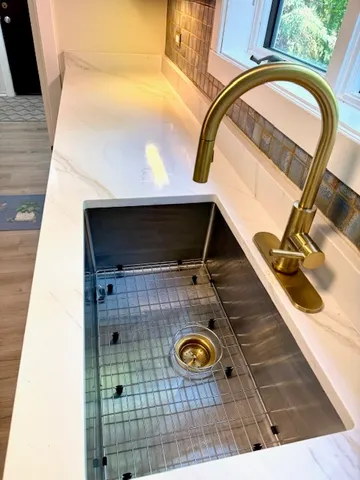 a kitchen with wooden cabinets and a stove top oven