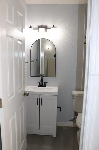 a bathroom with a sink and mirror