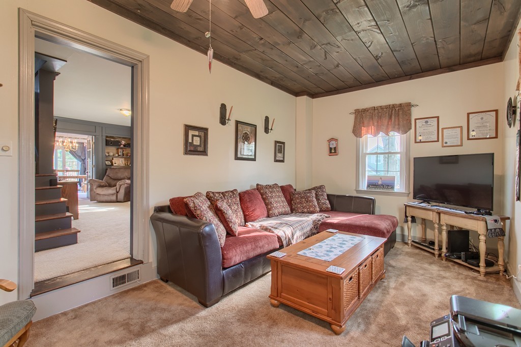 318 Patriots Road Templeton, MA 01468 - Photo 21 of 30 a living room with furniture and a flat screen tv