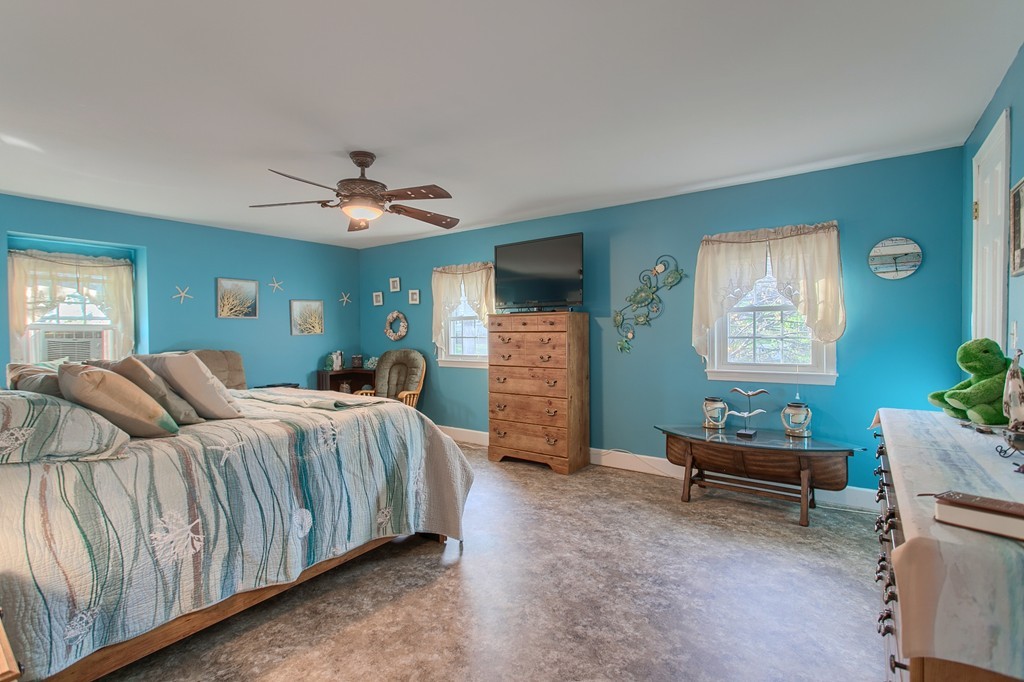 318 Patriots Road Templeton, MA 01468 - Photo 23 of 30 a bedroom with a bed and a couch