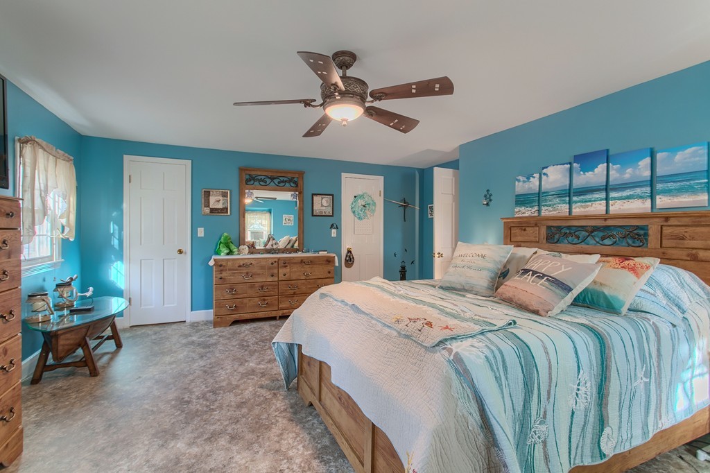 318 Patriots Road Templeton, MA 01468 - Photo 25 of 30 a bed room with a bed and a couch