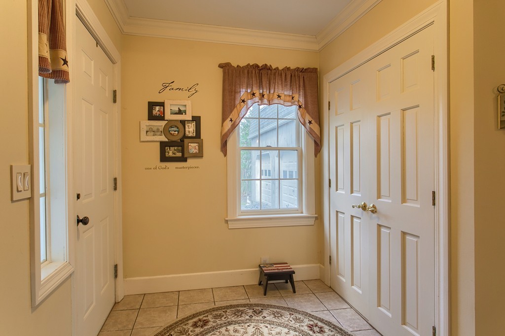 318 Patriots Road Templeton, MA 01468 - Photo 9 of 30 a view of a bedroom with a door and a window