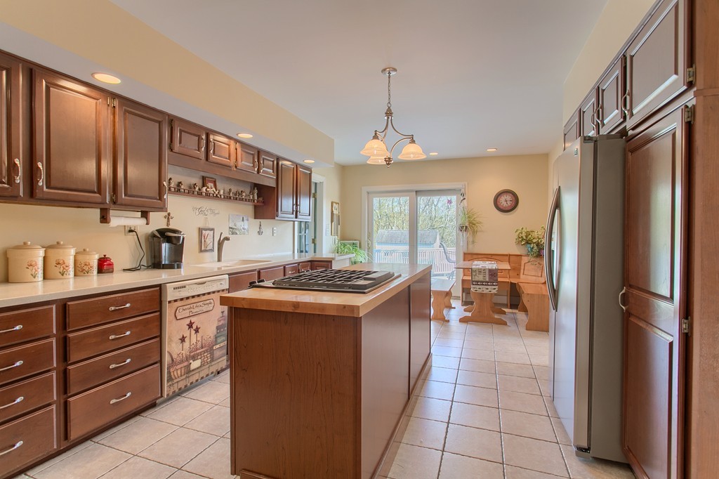 318 Patriots Road Templeton, MA 01468 - Photo 10 of 30 a kitchen with stainless steel appliances granite countertop a sink and a refrigerator