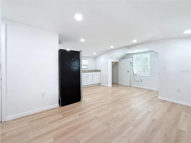 a view of kitchen with a refrigerator