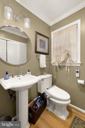 a white toilet sitting next to a bathroom sink