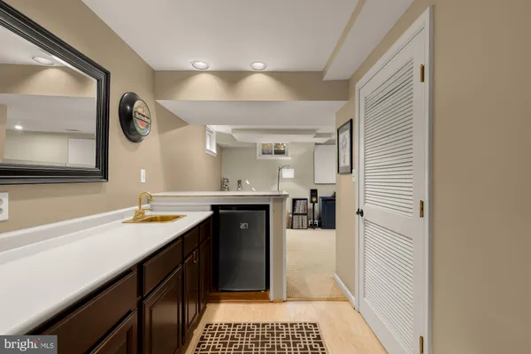 a kitchen with a sink and a refrigerator
