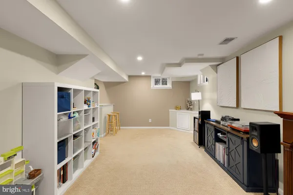 a kitchen with stainless steel appliances a stove a sink and a refrigerator