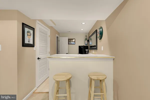 a kitchen with stainless steel appliances a refrigerator and cabinets