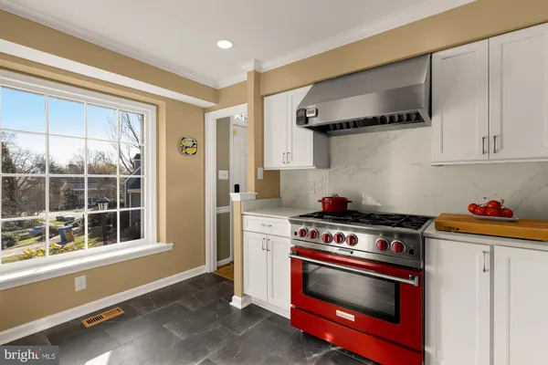 a kitchen with stainless steel appliances a stove and a refrigerator