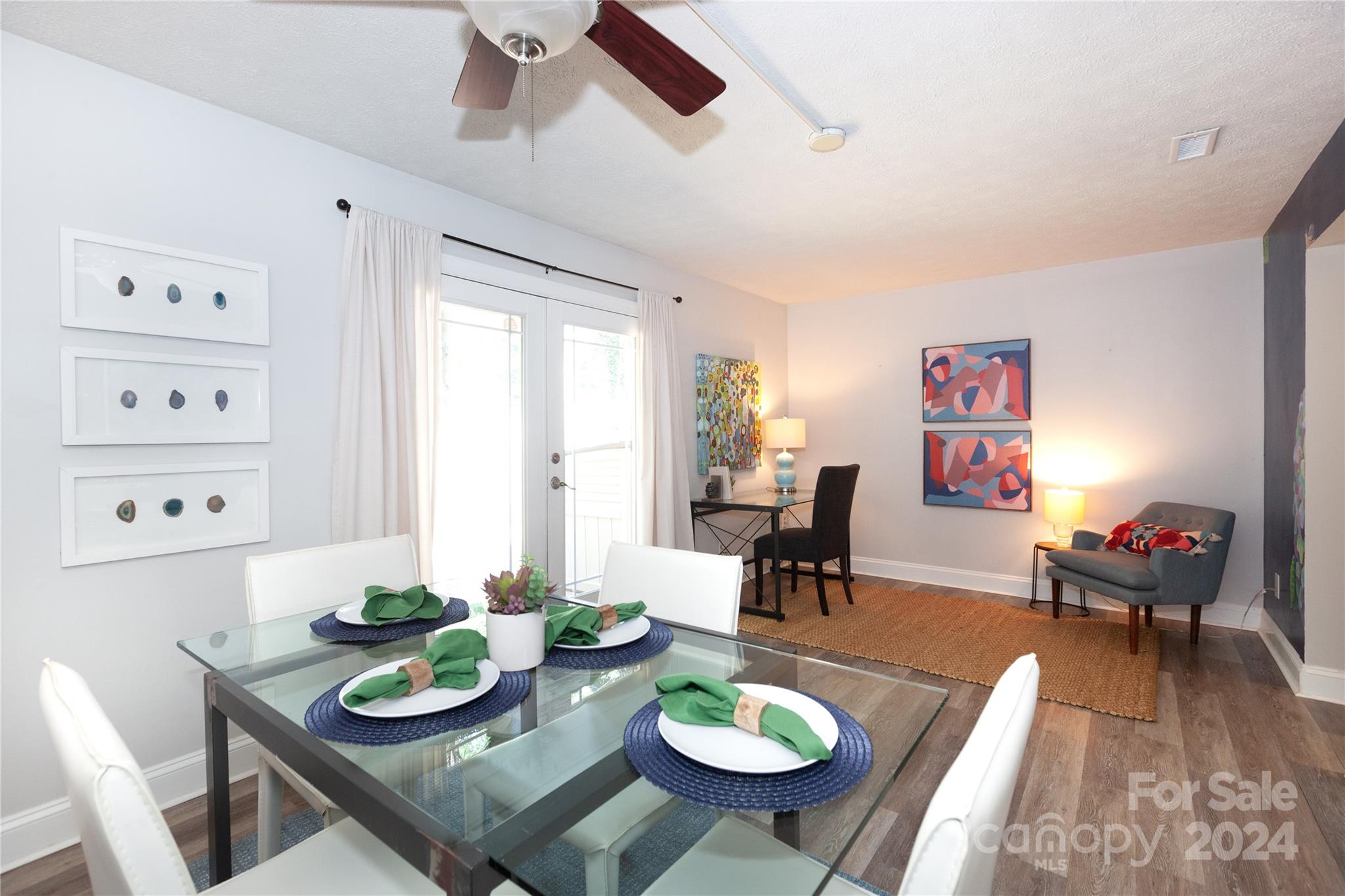 1201 Scaleybark Road, Unit B Charlotte, NC 28209 - Photo 11 of 29 a view of a dining room with furniture a rug and wooden floor