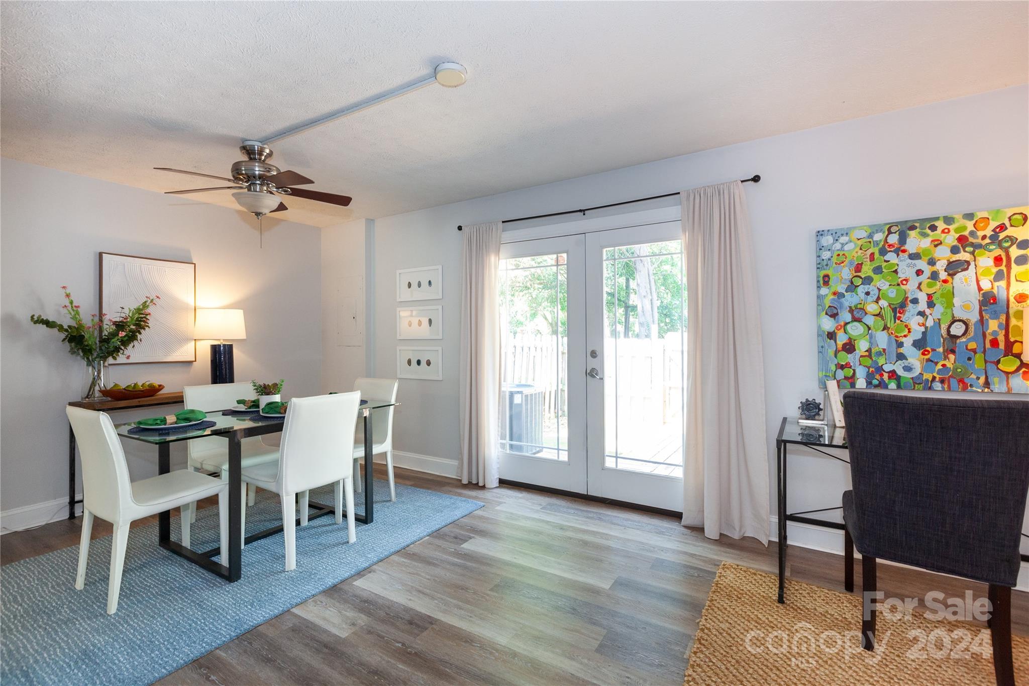1201 Scaleybark Road, Unit B Charlotte, NC 28209 - Photo 13 of 29 a view of a dining room with furniture a chandelier and wooden floor