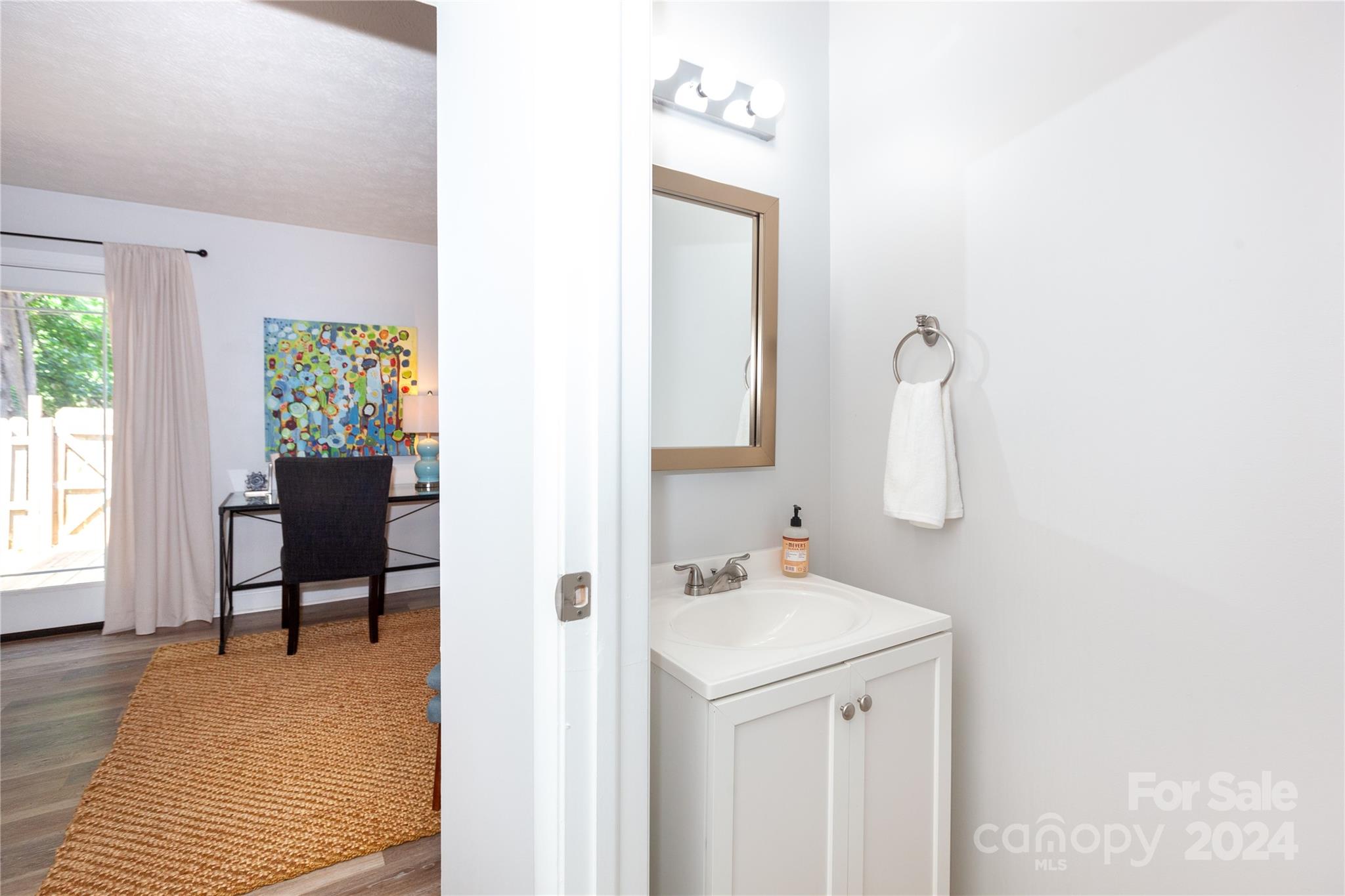 1201 Scaleybark Road, Unit B Charlotte, NC 28209 - Photo 18 of 29 a en suite bathroom with a sink and a mirror