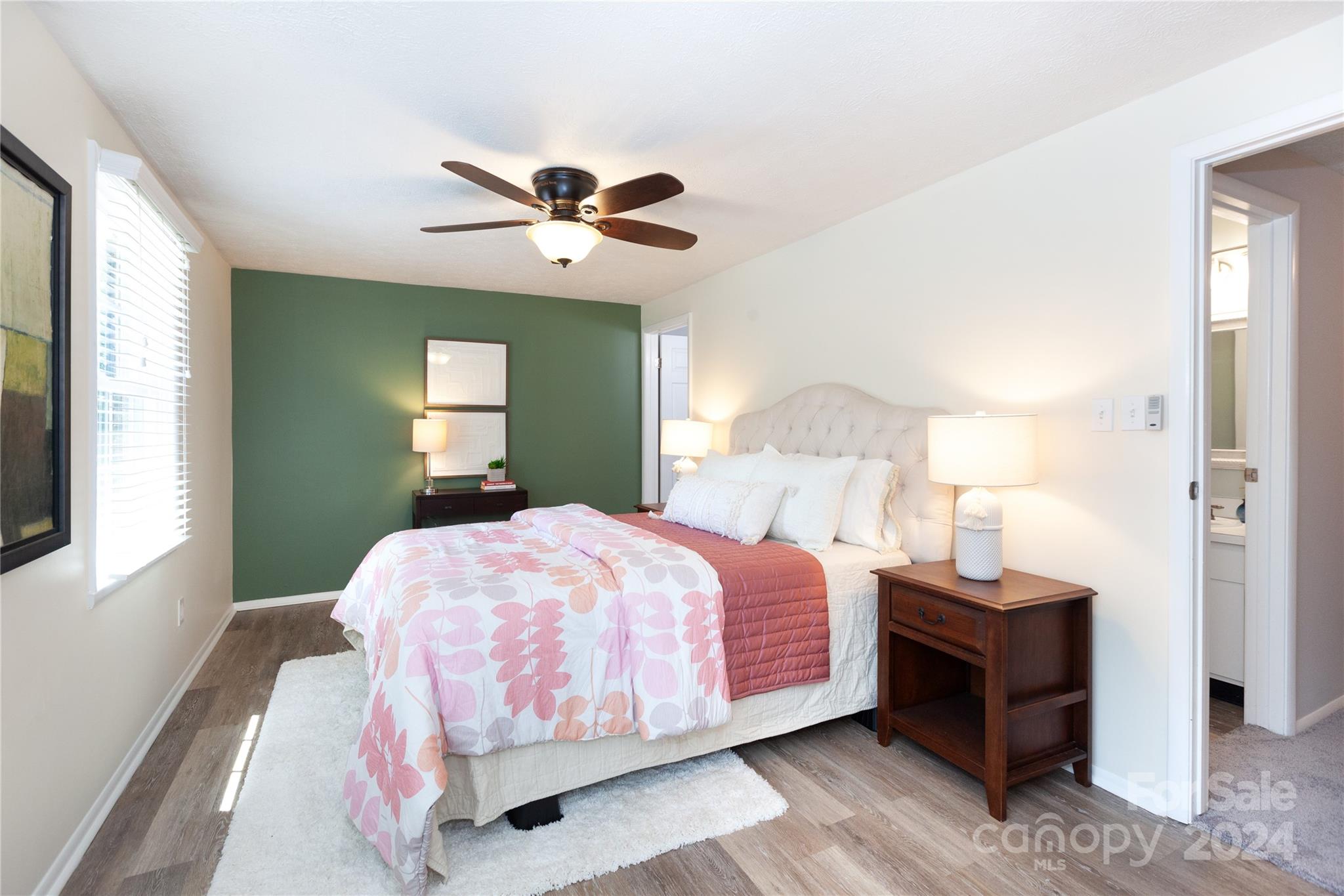 1201 Scaleybark Road, Unit B Charlotte, NC 28209 - Photo 19 of 29 a bedroom with a bed and a chandelier