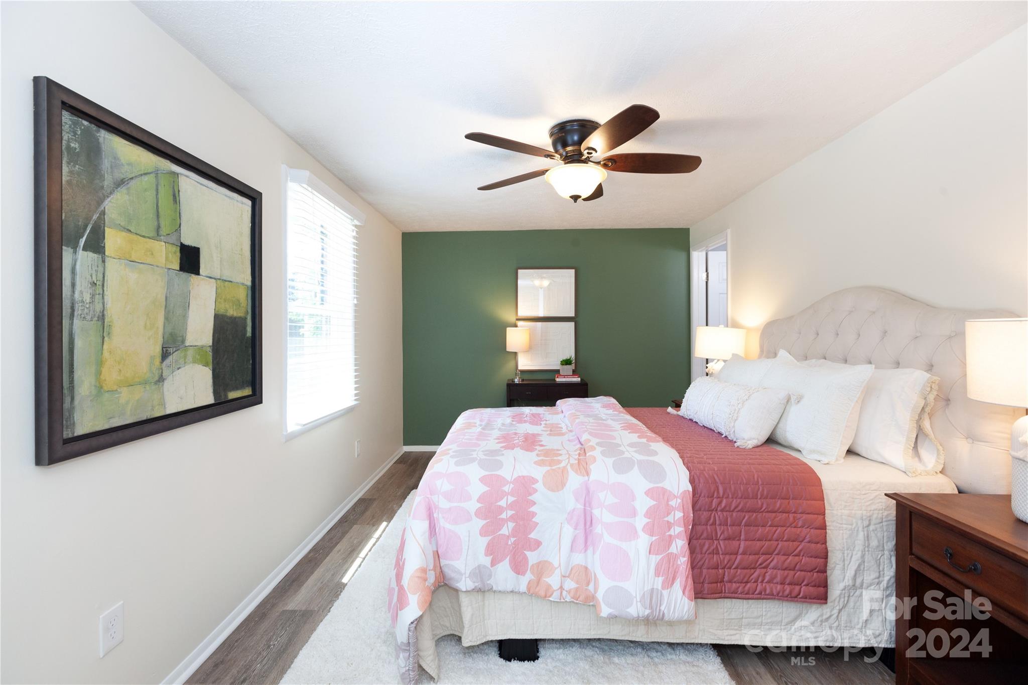 1201 Scaleybark Road, Unit B Charlotte, NC 28209 - Photo 20 of 29 a bedroom with a bed and a painting on the wall
