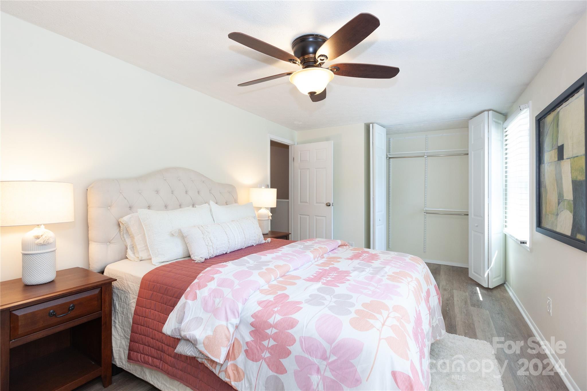 1201 Scaleybark Road, Unit B Charlotte, NC 28209 - Photo 21 of 29 a bedroom with a large bed and a chandelier