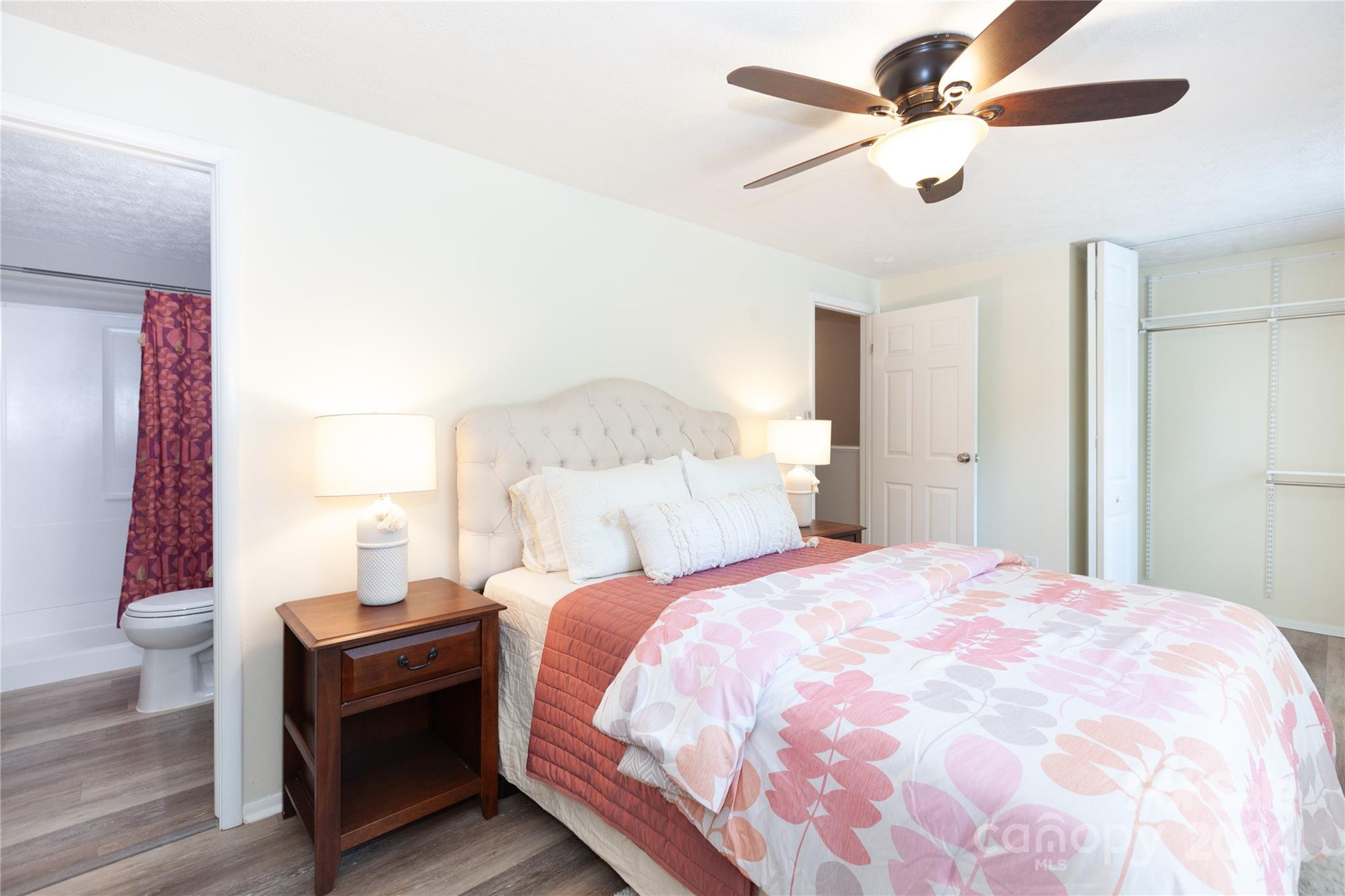 1201 Scaleybark Road, Unit B Charlotte, NC 28209 - Photo 22 of 29 a bedroom with a bed and a chandelier