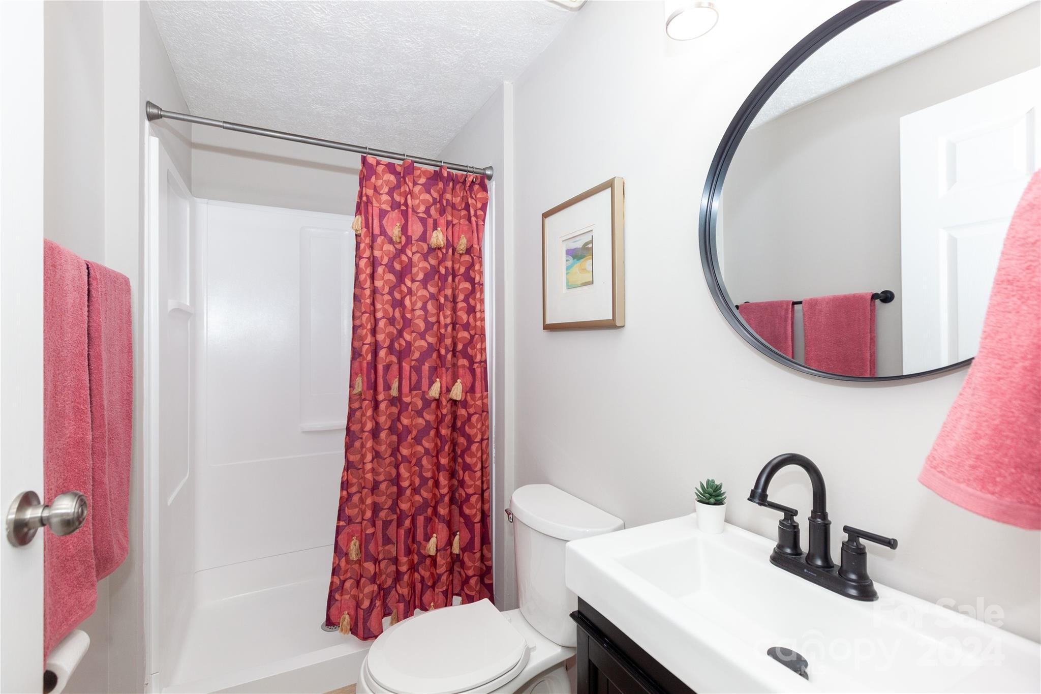 1201 Scaleybark Road, Unit B Charlotte, NC 28209 - Photo 23 of 29 a bathroom with a sink and a mirror