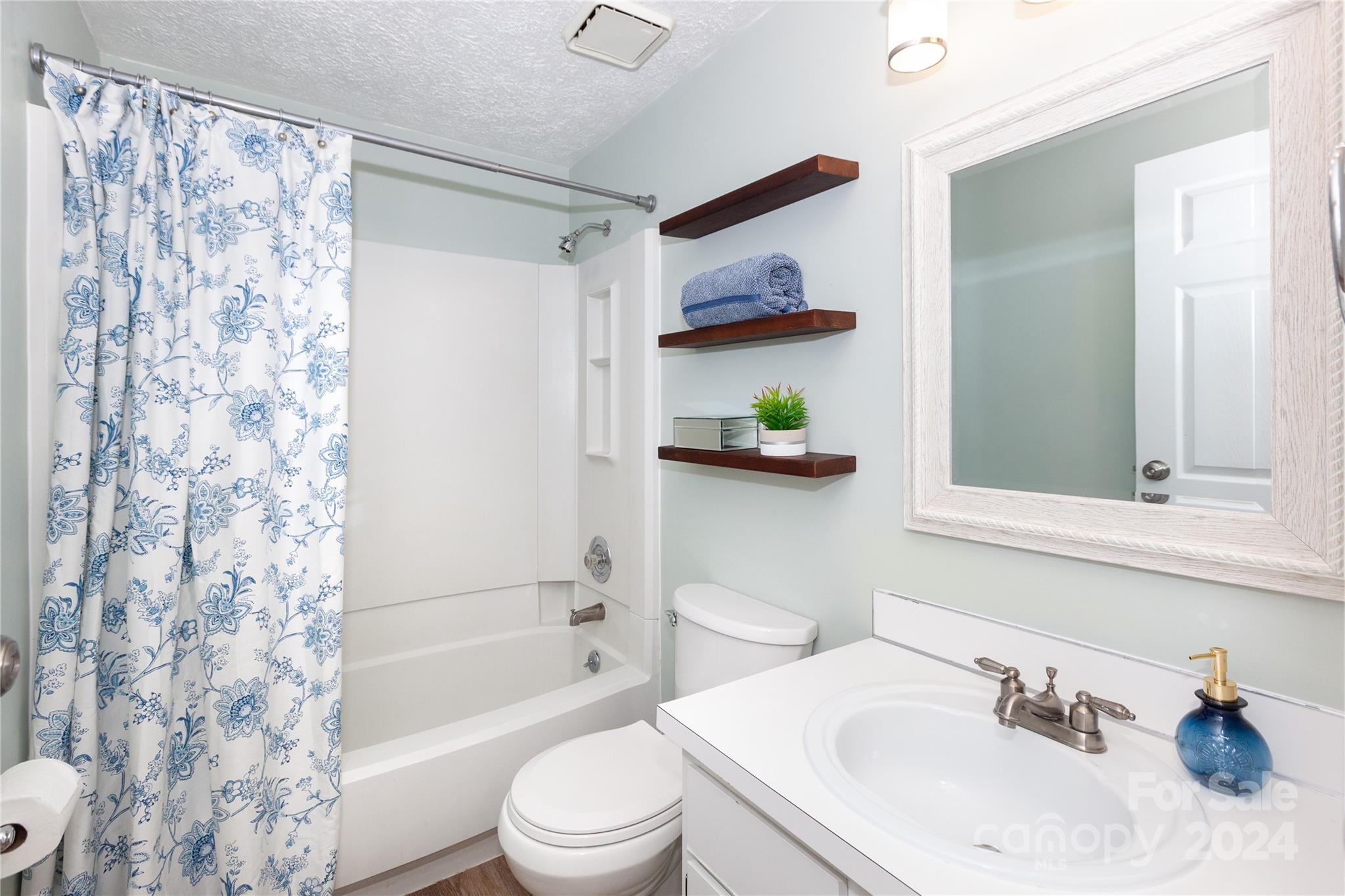 1201 Scaleybark Road, Unit B Charlotte, NC 28209 - Photo 26 of 29 a bathroom with a sink toilet and shower