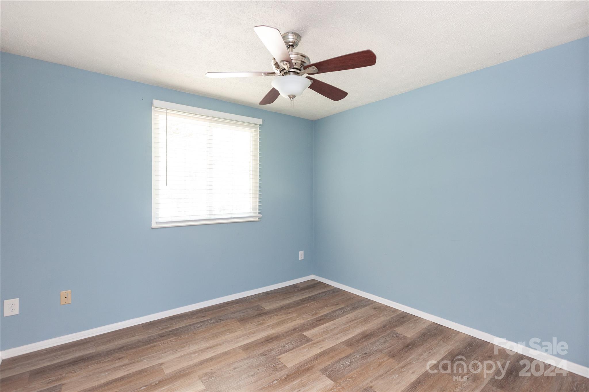 1201 Scaleybark Road, Unit B Charlotte, NC 28209 - Photo 27 of 29 an empty room with a window and a fan