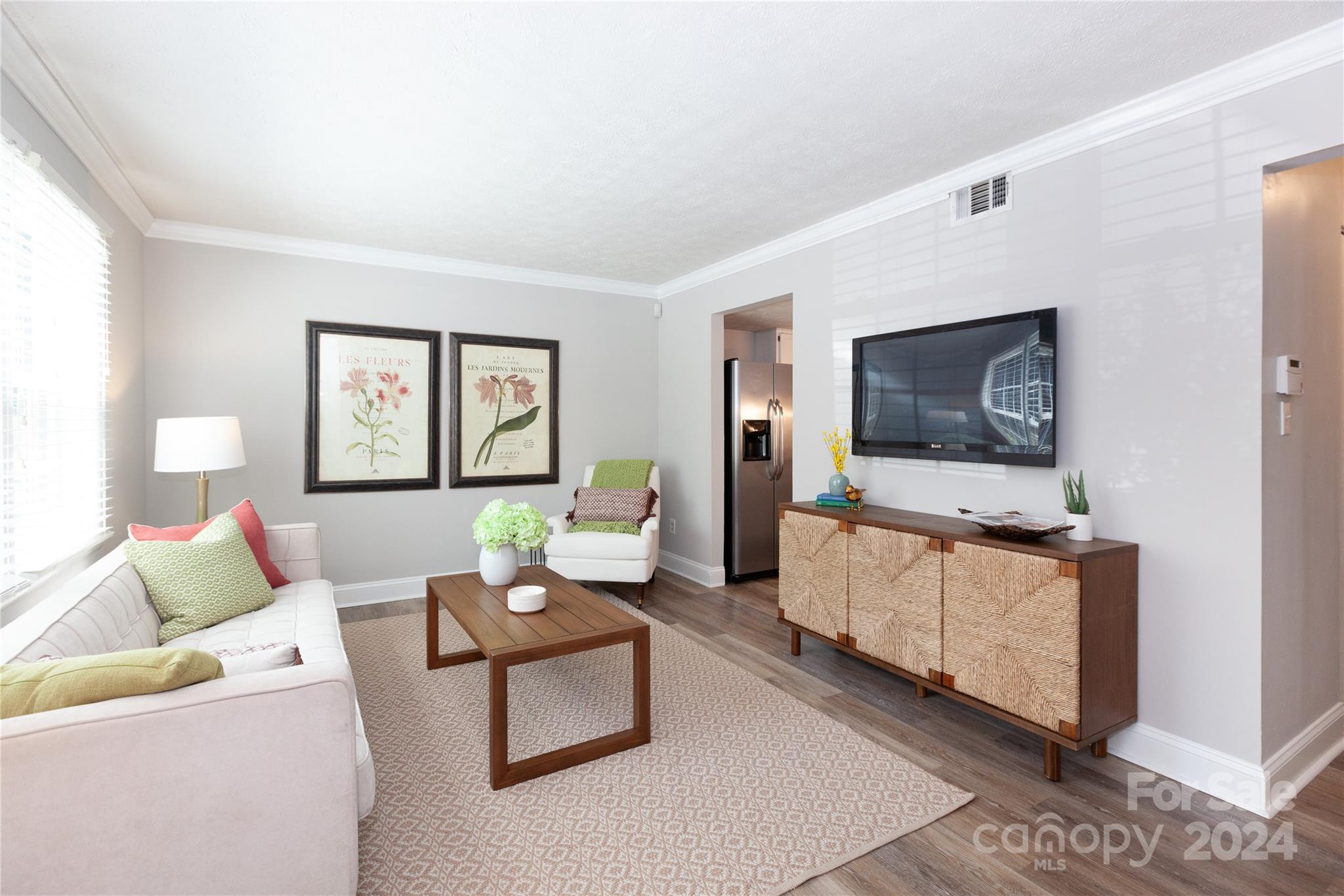 1201 Scaleybark Road, Unit B Charlotte, NC 28209 - Photo 3 of 29 a living room with furniture and a flat screen tv