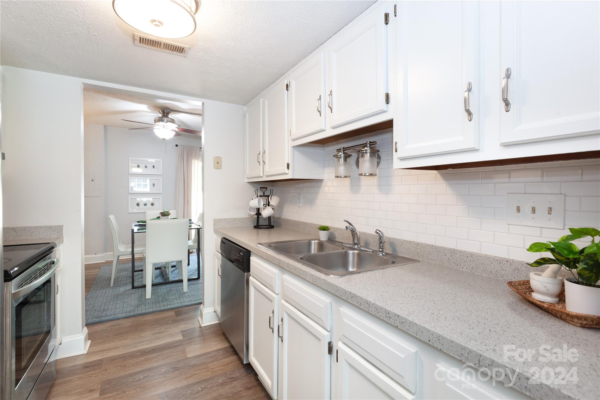 1201 Scaleybark Road, Unit B Charlotte, NC 28209 - Photo 7 of 29 a kitchen with a sink stove and cabinets