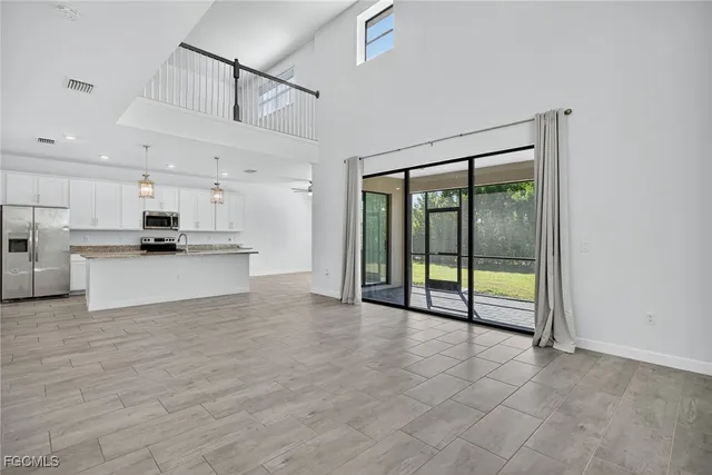 a view of a kitchen with a sink and a stove top oven