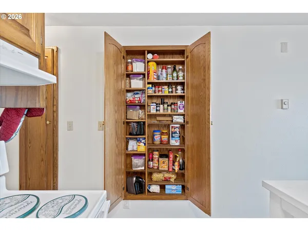 a view of a bedroom with a bookshelf