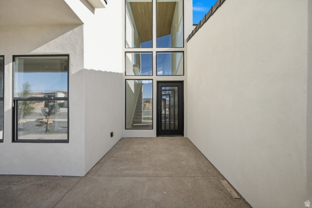 3011 East Rimrunner Drive, Unit 302 St. George, UT 84790 - Photo 6 of 45 Property entrance featuring stucco siding and a patio area
