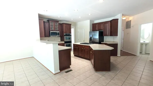 a view of a dining room with furniture and window