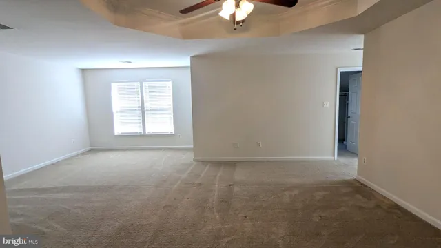 a view of closet area with empty racks