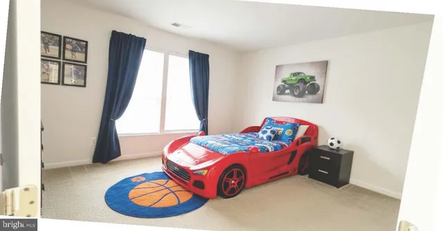 a bathroom with a toilet a sink and a mirror