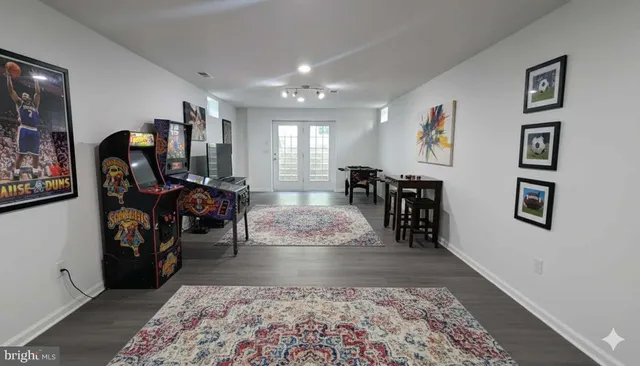 a view of a patio with a table and chairs under an umbrella