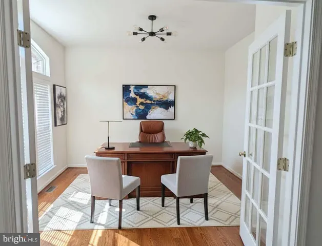 a view of room with window and wooden floor