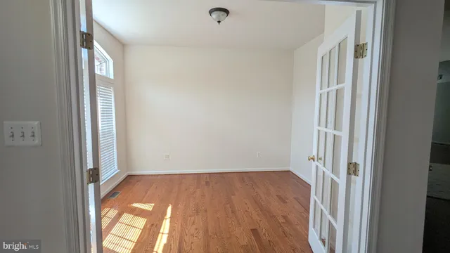 a living room with furniture and painting on the wall