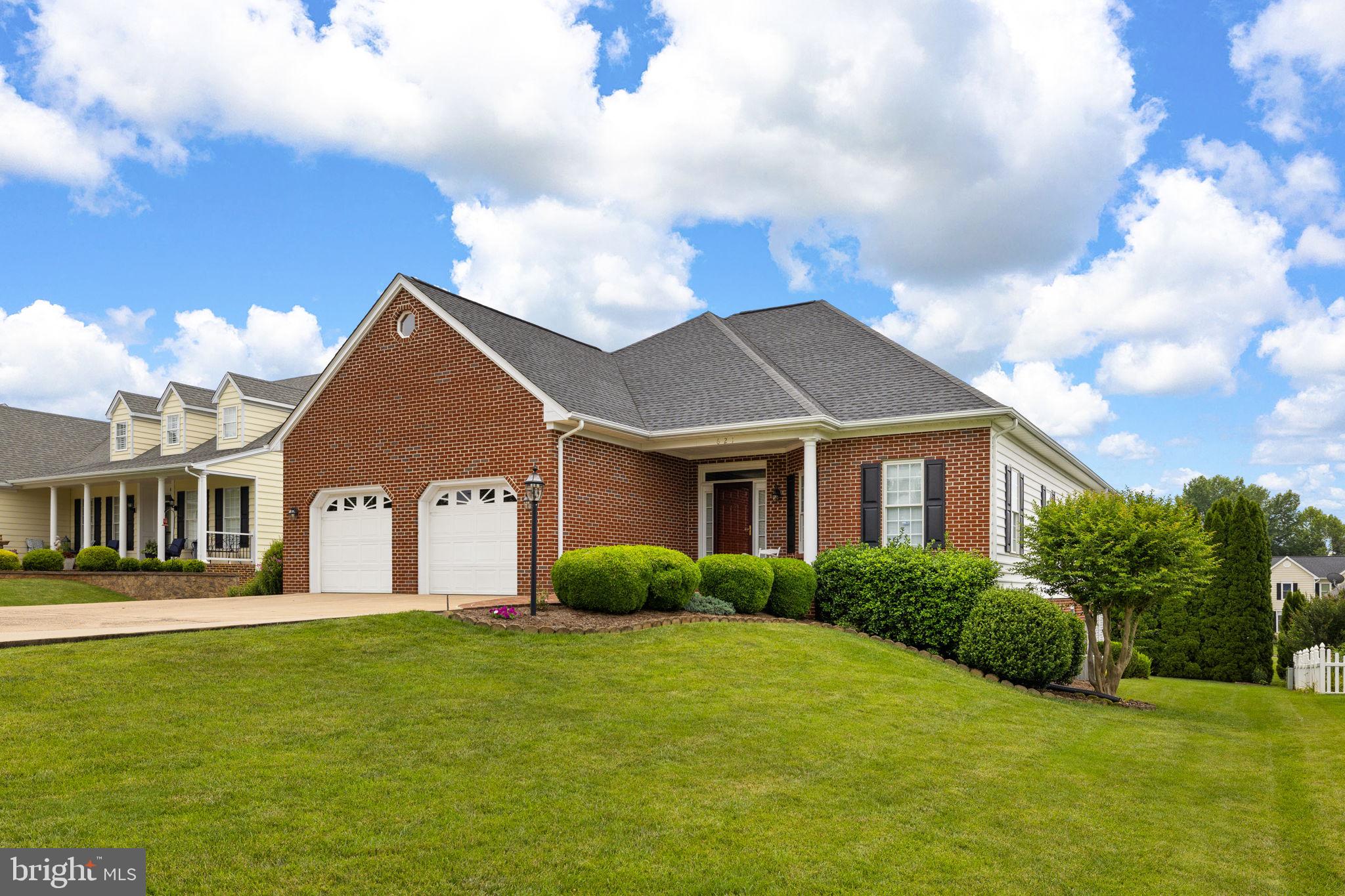 621 Country Club Road Culpeper, VA 22701 - Photo 3 of 45 Charming brick home with lush greenery.