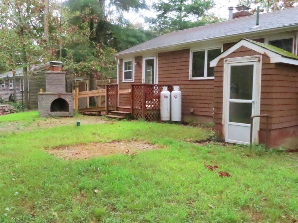 16 Route 130 Sandwich, MA 02644 - Photo 17 of 18 a front view of house with yard and green space