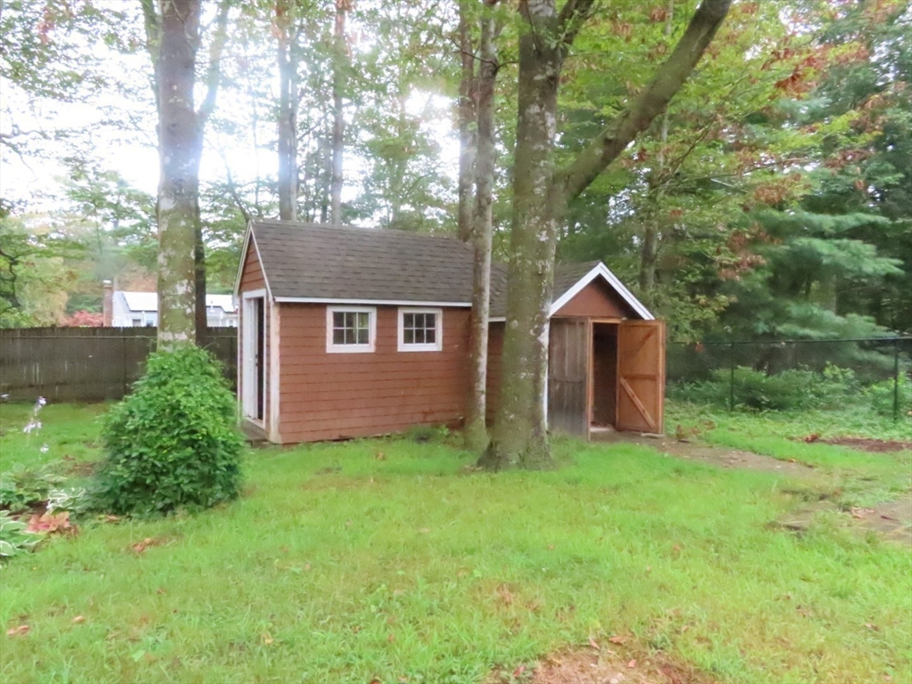 16 Route 130 Sandwich, MA 02644 - Photo 18 of 18 a front view of a house with yard and trees