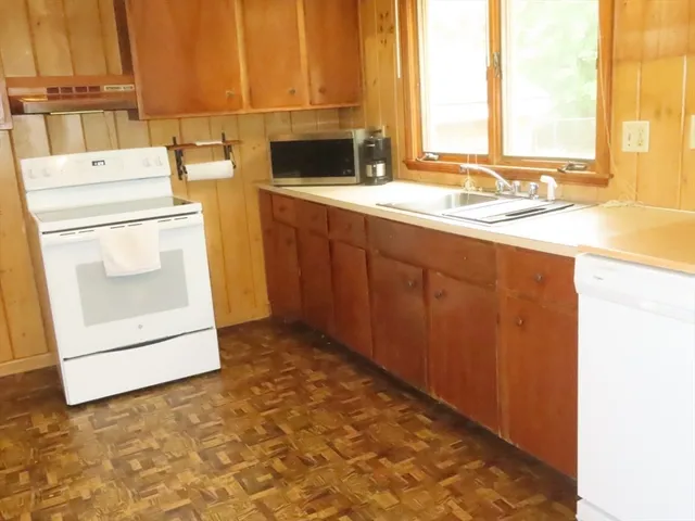 a kitchen with a sink and a window