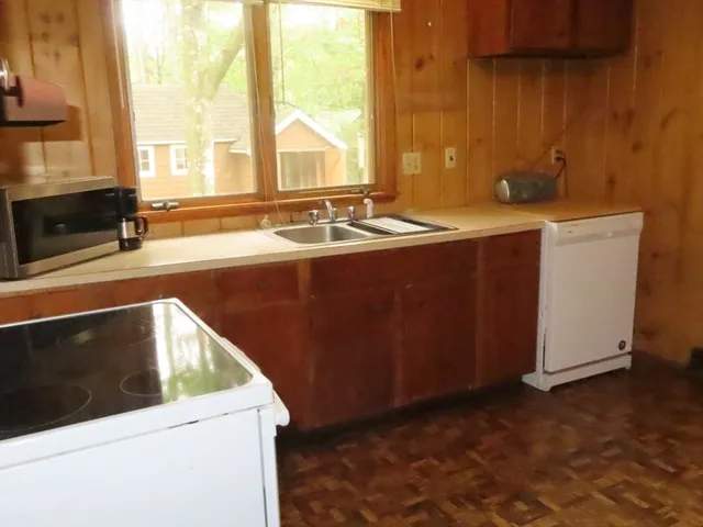 a bathroom with a sink and a window