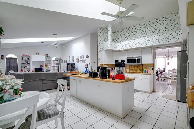 a kitchen with a sink cabinets and window